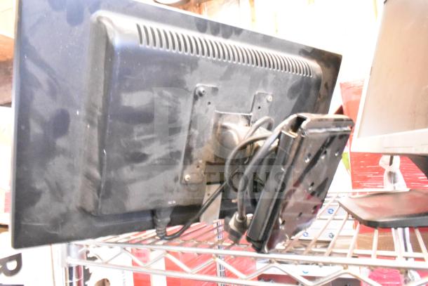 Four monitors on a shelf, including Costar, HP Compaq LE1711, Elo TouchSystems, Acer S240HL. Includes cables. Used condition.