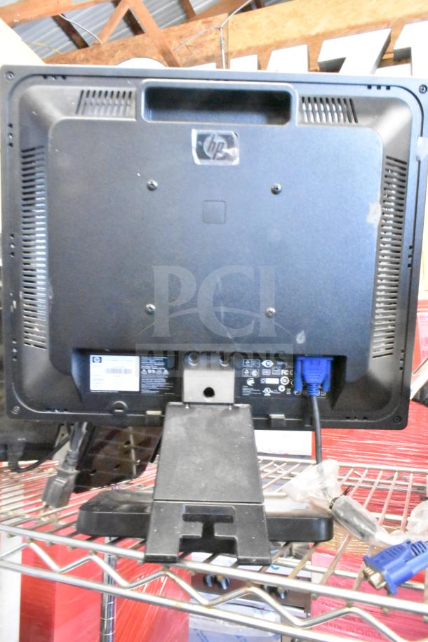 4 various monitors, including HP Compaq LE1711. Features include VGA port. Mixed conditions. Auction lot for resale.