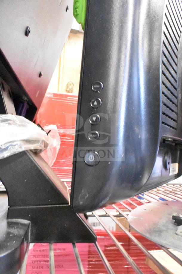 Four monitors including Costar, HP Compaq LE1711, Elo TouchSystems, and Acer S240HL, detail of side control buttons.