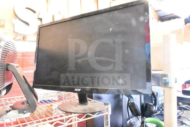 Four monitors including Costar, HP Compaq LE1711, Elo TouchSystems, Acer S240HL on a shelf. Moderate wear visible.