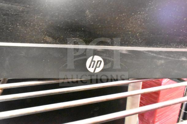 HP E222 monitor, black bezel with visible logo, includes dust on screen. Part of auction with Dell E1715S monitor.