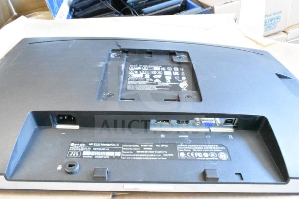 Back view of HP E222 monitor showing ports and labels, including HDMI and VGA inputs. Condition appears used.