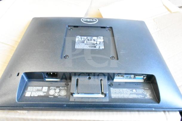 Back view of a Dell E1715S monitor showing ports and labels. Part of auction with a second monitor, condition not specified.