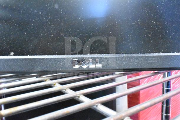 Two monitors: HP E222 and Dell E1715S, shown in dusty condition on metal shelving.