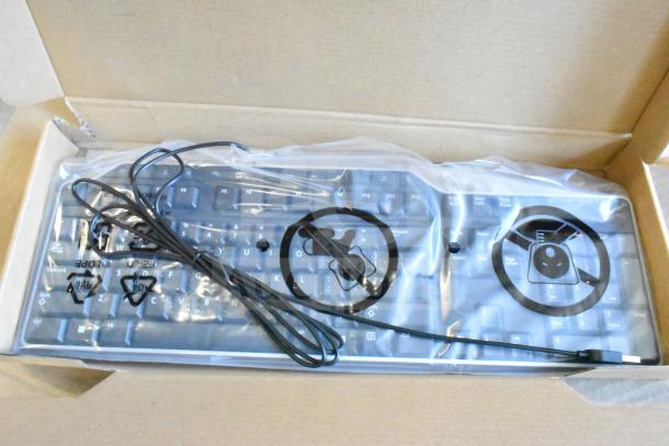 Dell keyboard in original packaging, new condition, USB connection, part of auction lot with 8 additional items.