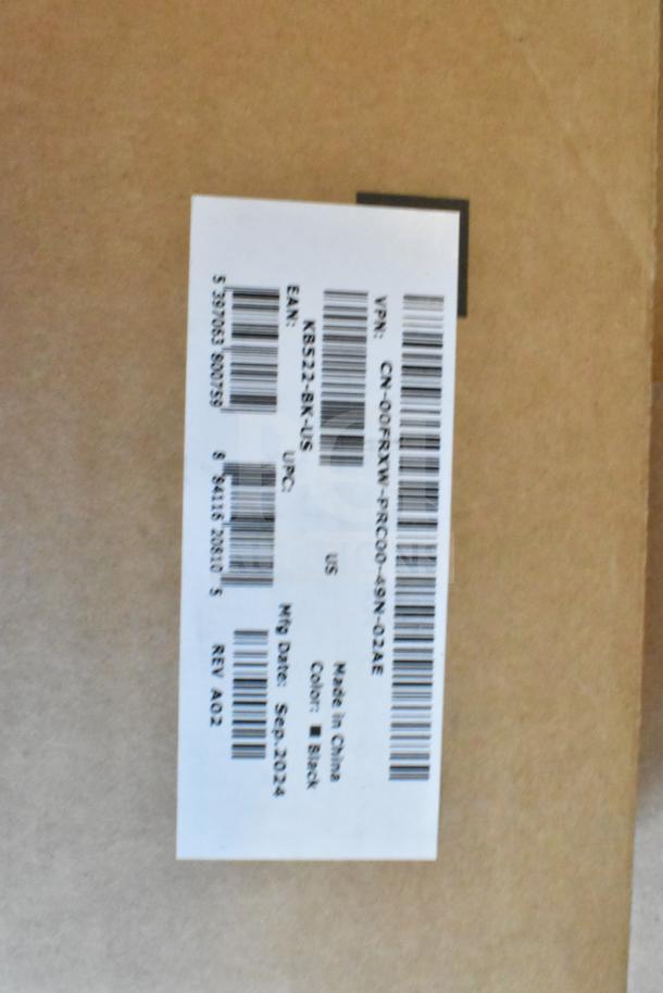 Label on cardboard box showing details: Dell KB522 keyboard, black, made in China, manufactured September 2024.