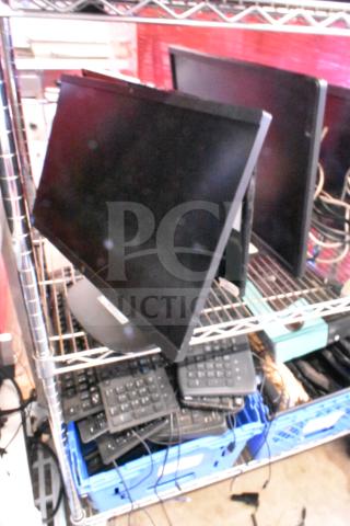 Five various monitors including HP, Onn ONA18HO015 21.5", Dell E2414Ht, IBM, displayed on metal shelf. Good condition.