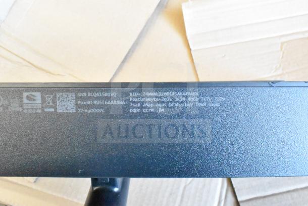 Five monitors including HP, Onn ONA18HO015 21.5", Dell E2414Ht, IBM; features model and product IDs on label.