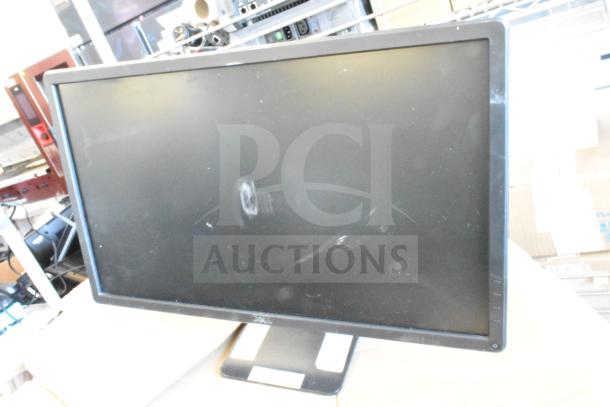 Five monitors including HP, Onn ONA18HO015 21.5", Dell E2414Ht, and IBM; visible wear, auction lot.