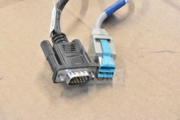 Image shows VGA and USB cables, possibly related to the 5 various monitors auctioned, including brands HP, Onn, Dell, IBM.