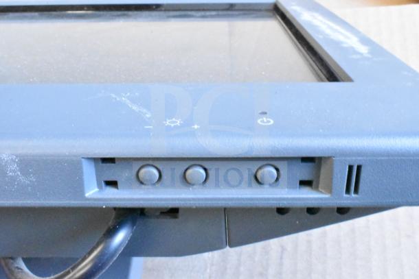 Five assorted monitors including HP, Onn ONA18HO015 21.5", Dell E2414Ht, and IBM. Controls and minor wear visible.