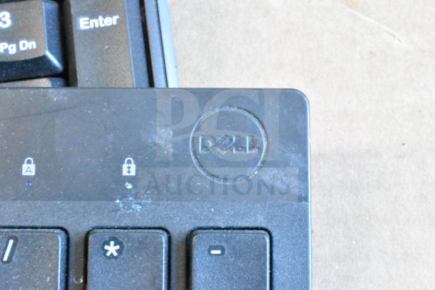 Dell keyboard with visible locks indicator, part of a lot of 40 keyboards. Some wear noted on surface.