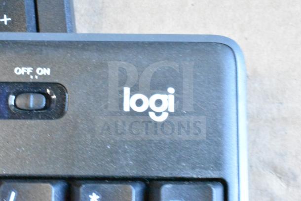 Lot of 40 Logitech computer keyboards, black, with on/off switch, slight wear. Logo visible on top right corner.