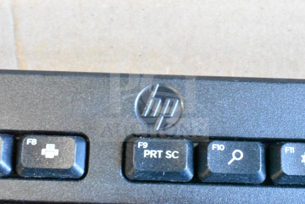 40 HP computer keyboards, black, featuring function keys. Ideal for bulk purchase. Auction offers 40 times your bid.