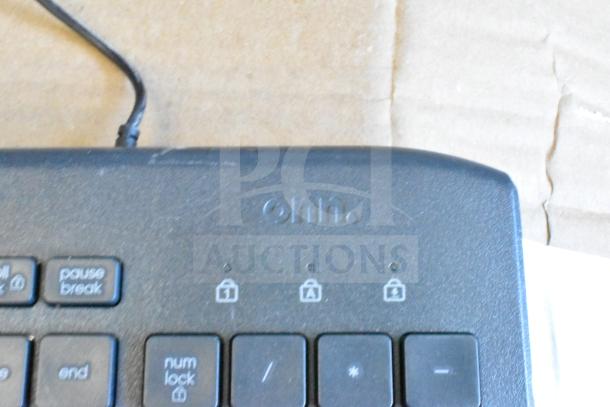 Onn brand keyboard featuring standard keys, black finish, and functional indicators. Condition appears gently used.