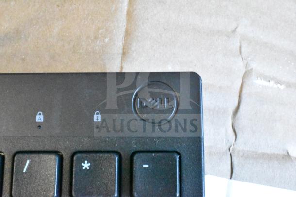 Dell keyboard, black, partial view showing logo and lock indicators, auction includes 40 units.