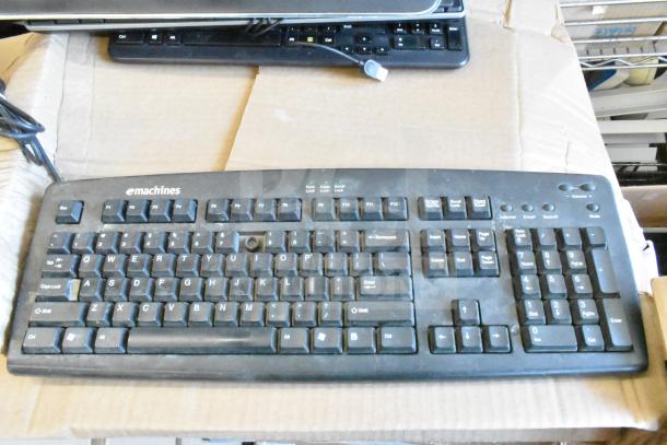 Bulk lot of 40 eMachines computer keyboards, black, standard layout with USB connection. Used condition.