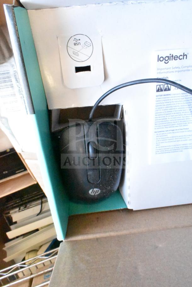 HP wired computer mouse in used condition, included in a lot of 40 items with Logitech packaging visible.