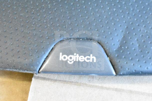 Logitech textured surface with logo, part of a 40-item auction including keyboards and mice.