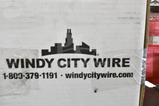 Box labeled "Windy City Wire" with contact info, possibly shipping packaging.