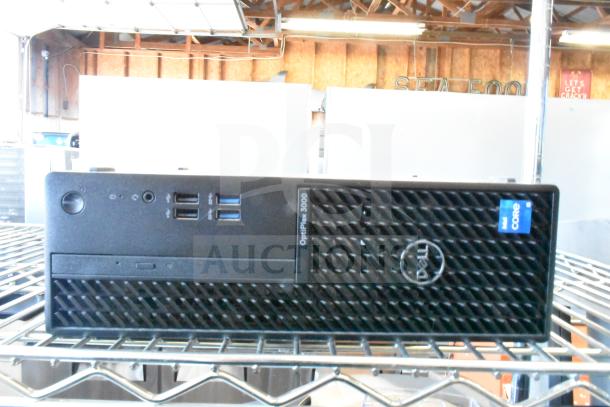 Dell OptiPlex 3000 tower, front panel with Intel Core sticker, USB ports, in used condition.
