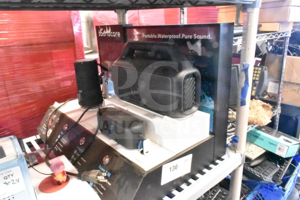 Soundcore store display with portable, waterproof speakers. Includes Boom 2 SE model. Features various sound options.