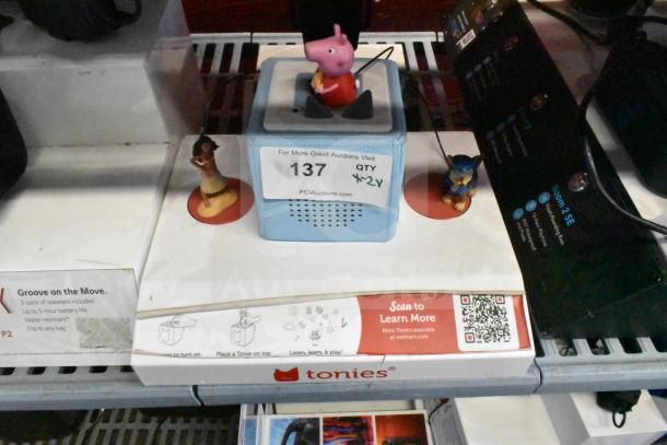 Tonie Box display with Moana, Paw Patrol, Peppa Pig characters, and RecoveryTherm Cube. Item label "137, QTY x2."