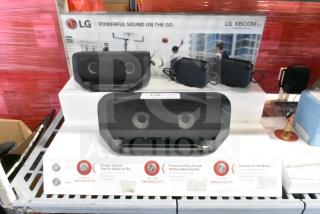 LG store display featuring LG Xboom speakers, showcasing model P5. Features include powerful sound, water resistance, and battery life details. Display includes promotional text and product images.