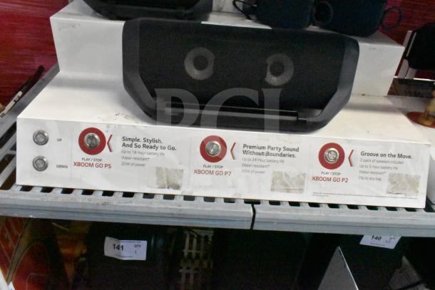 LG store display featuring an LG Xboom speaker. Includes models P2, P5, P7 with details on battery life and power.