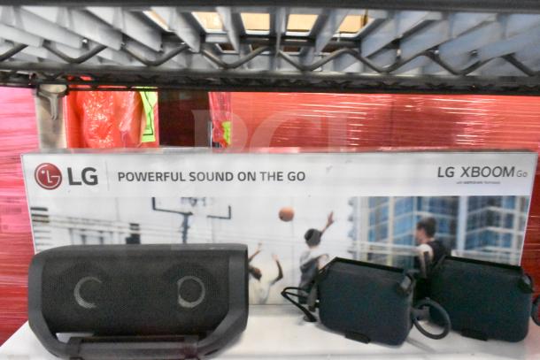 LG store display featuring an LG Xboom speaker, showcasing "Powerful Sound on the Go," with Meridian technology.