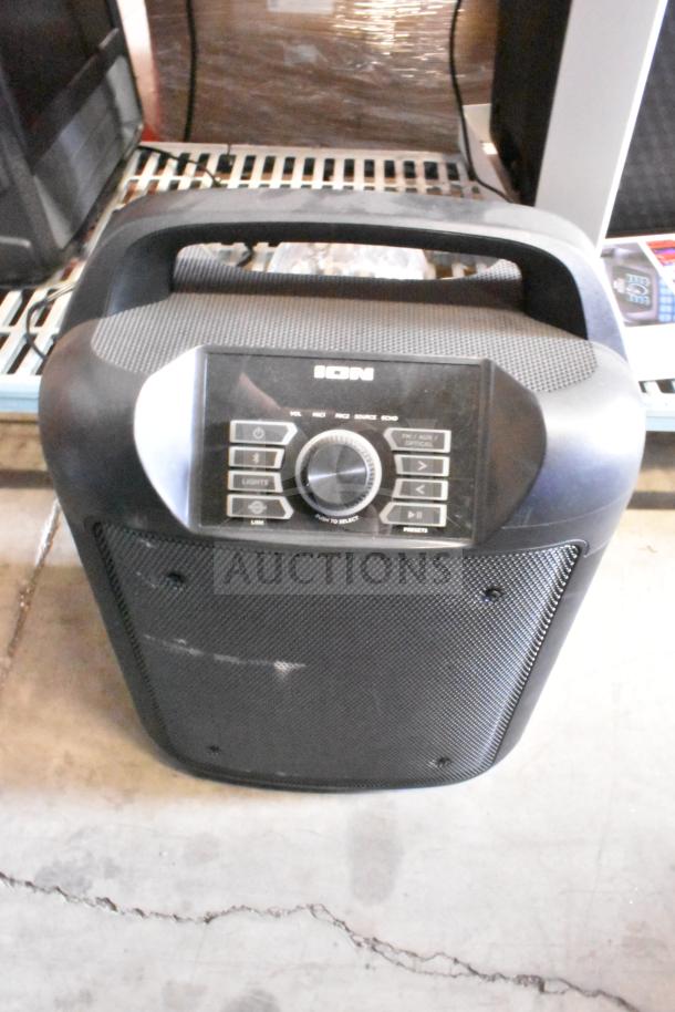 Ion portable speaker with black casing and control panel. Features volume, input, and preset buttons. Scratches visible.