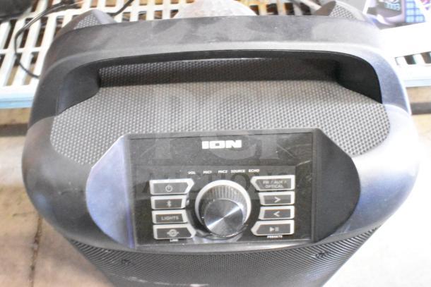 Ion portable speaker with control panel, featuring volume, mic inputs, source options, and FM/AUX. Used condition.