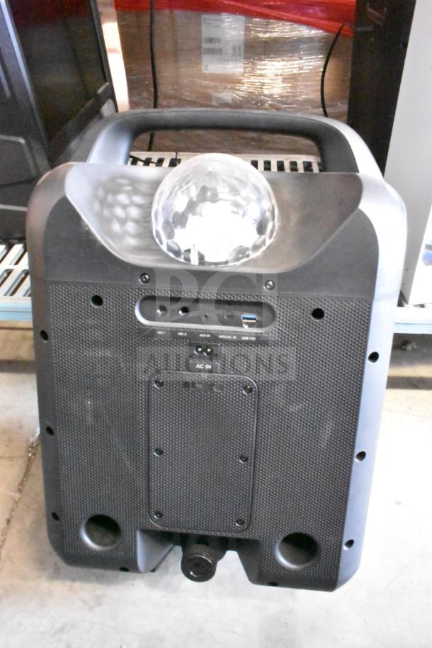 Ion speaker with a built-in light dome, featuring various input ports and AC in, in good condition.