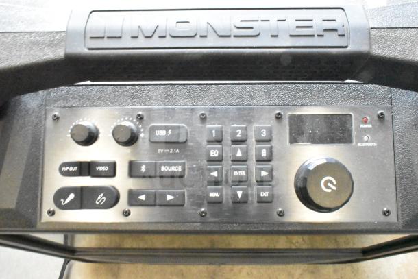 Monster MNVISION156-C Visioni 15.6" speaker control panel, featuring volume knobs, USB port, and menu buttons.