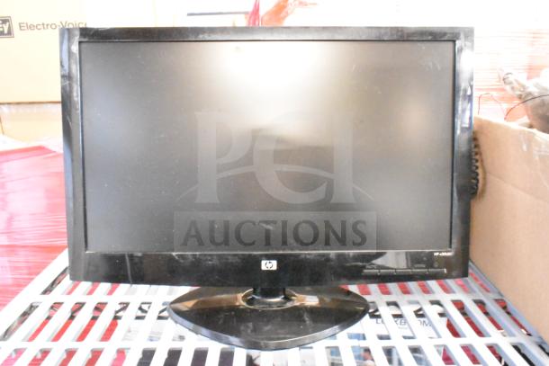 HP LCD monitor with a black frame, visible HP logo. Slight wear marks, part of a 25-item auction including Samsung and Dell monitors.