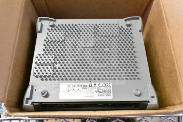 Sensormatic ZBAMB9012 label deactivator antenna in box, showing textured surface and label markings for model and specs.