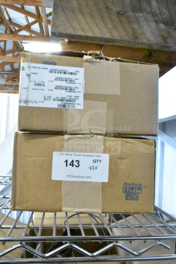 Boxes containing Sensormatic ZBAMB9012 Label Deactivator Antenna and Sensormatic ZBSMPCPEF EAS Deactivator Pad.