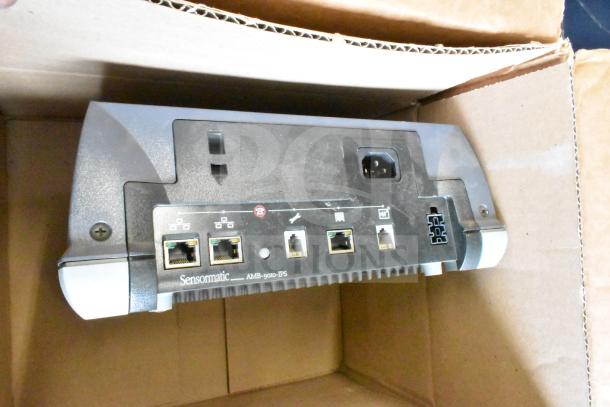 Sensormatic ZBAMB9010-IPS Label Deactivator Controller with ports, in box. Includes cables, ideal for retail security.