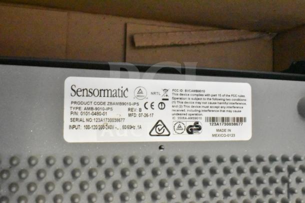 Sensormatic ZBAMB9010-IPS Label Deactivator Controller, showing model and serial numbers, boxed with cables.