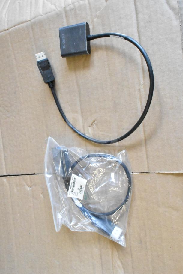 Lot with various items including a Toshiba price monitor cable. Items appear new, some in original packaging with visible labels.