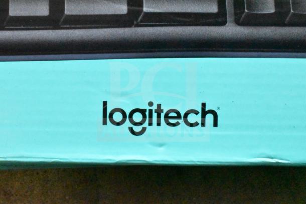 "Logitech keyboard box, part of a lot of 13 various computer keyboards, mint condition, auction item."