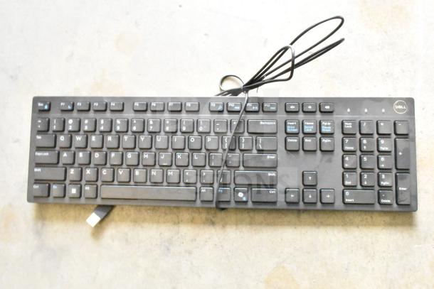 Dell wired keyboard with USB connector, black, showing full QWERTY layout; part of a lot of 13 keyboards.