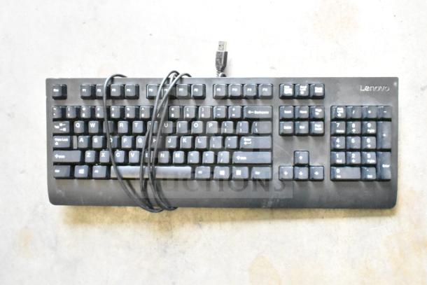 Lot of 13 computer keyboards, including Lenovo model. USB connection, used condition, features numeric keypad.