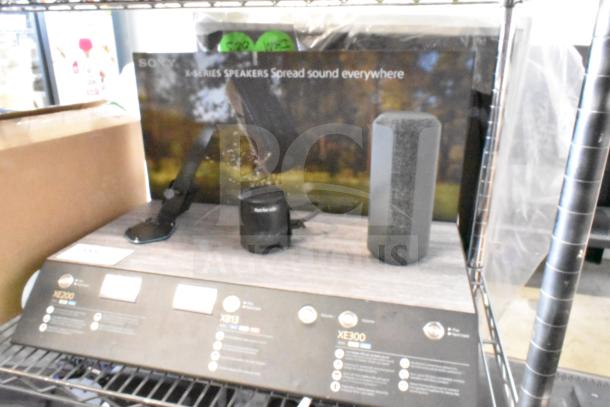 Sony store display with XE200, XB13, and XE300 speakers shown. "X-Series Speakers: Spread sound everywhere" text.