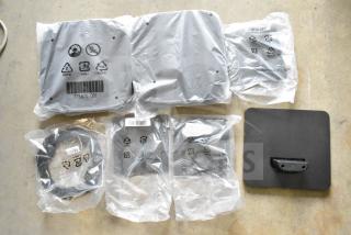 Lot of various electronic items including cables, packaged in protective bags, labeled with recycle symbols and barcodes.