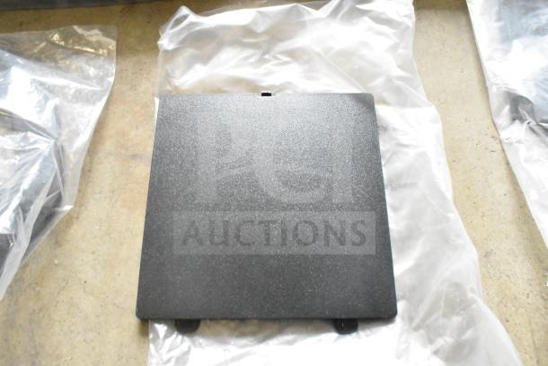 Lot of various items including cables, featuring a black textured panel, in good condition, laid on plastic wrap.