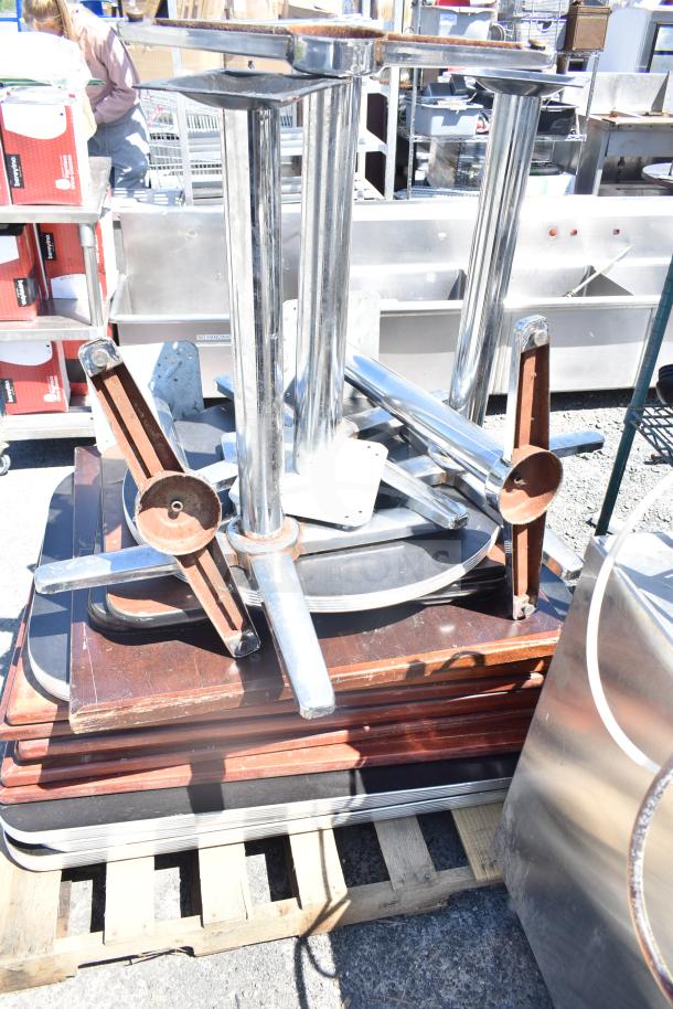 17 assorted tabletops and table bases, mixed materials, moderate wear. Auction lot; bid multiplies by 17.