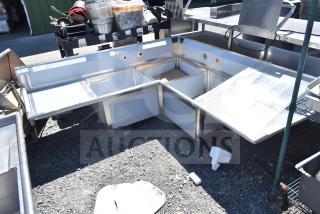 "Brand new Regency 600S3242424C L-shaped 3-bay sink with dual drain boards, no legs, scratch and dent condition."