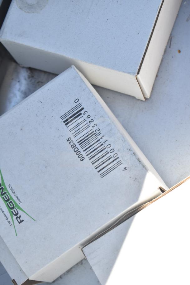 Close-up of Regency sink box showing model 600D835 barcode, indicating parts for an L-shaped 3-bay sink, no legs included.