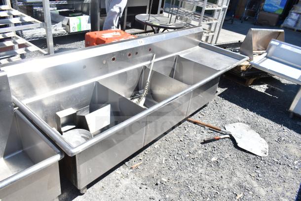 TSB-3-R2 commercial 3 bay sink with right side drain boards, no legs, in used condition, stainless steel construction.